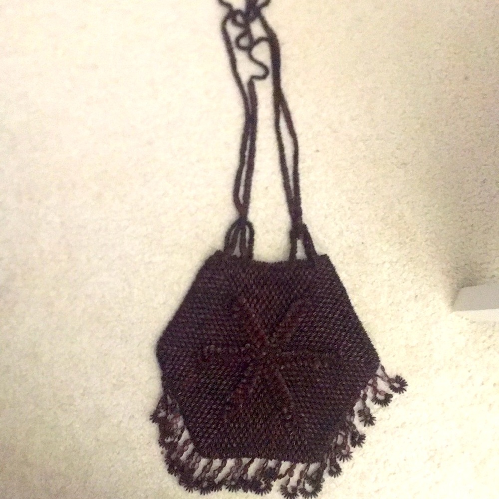 2 handmade bags that are exactly the same and are brown and long and beautiful